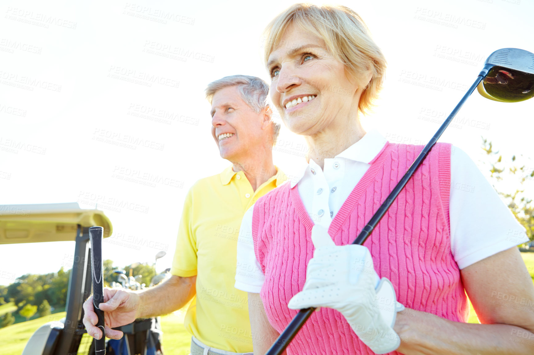 Buy stock photo Senior couple, outdoor and driver for golfing on course, retirement and bonding on holiday. People, cart and recreation activity for relationship connection, performance and support at driving range