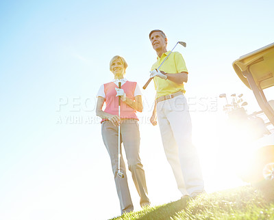 Buy stock photo Sports, golf and mature couple for game, match and competition on course, field and grass in morning. Retirement, hobby and man and woman for activity, fun and practice to relax, bonding and playing