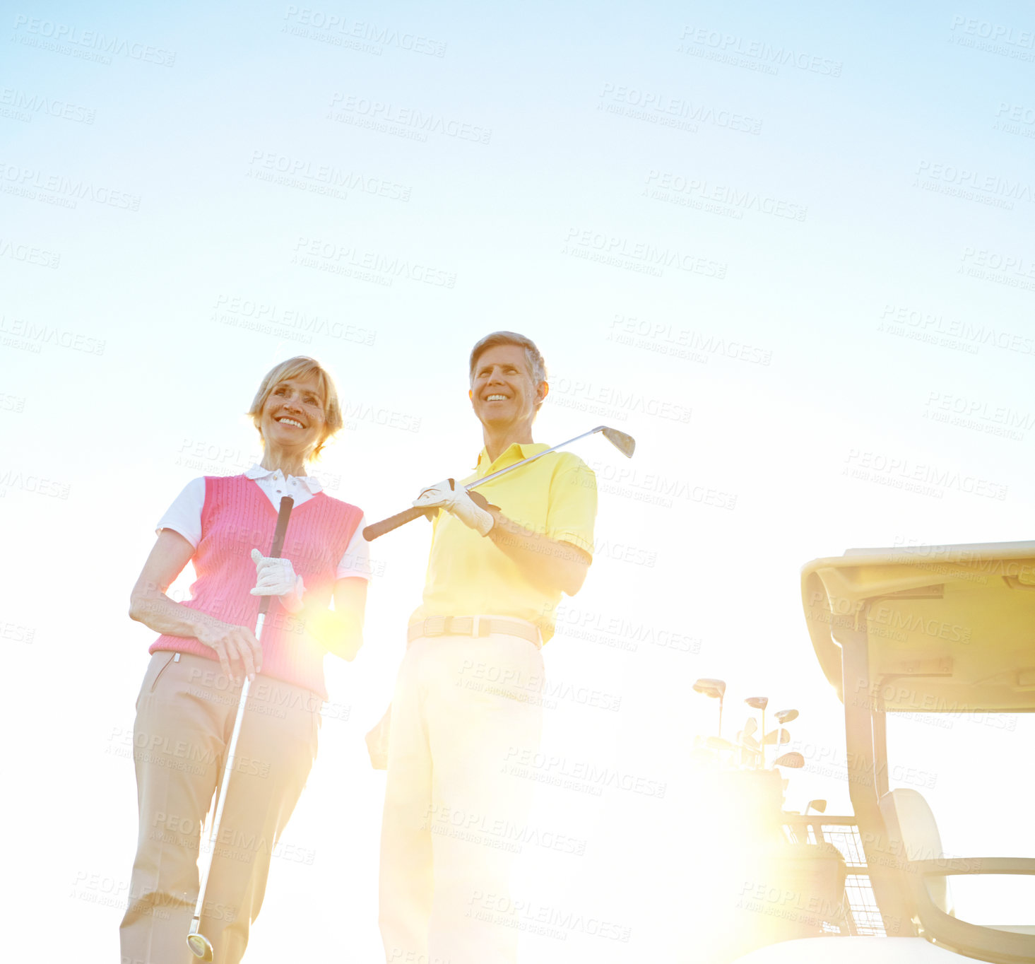 Buy stock photo Sports, golf and happy mature couple for game, match and competition on course, field and grass for activity. Golfer, lens flare and man and woman for hobby, fun and playing on holiday or vacation