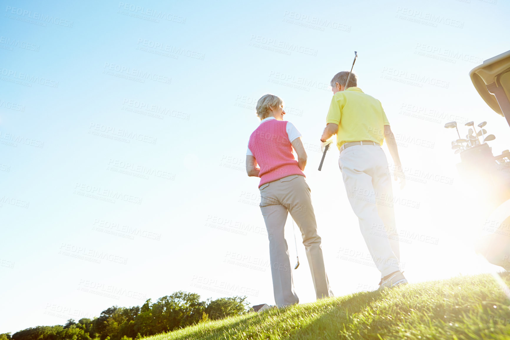 Buy stock photo Sports, golf and back of couple on course, field and grass for game, match and competition for activity. Retirement, mockup space and low angle of man and woman for playing, fun and practice together