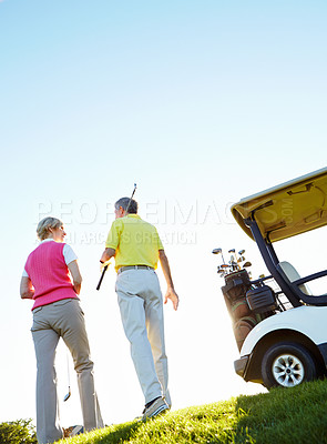 Buy stock photo Sports, golf course and back of couple for game, match and competition on field for activity in morning. Golfer, hobby and man and woman for playing, fun and practice together on vacation low angle