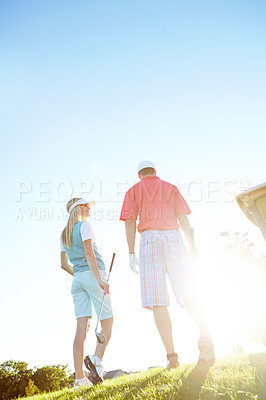 Buy stock photo Sports, golf and back of couple walking on course, field and grass for game, match and competition. Marriage, hobby and man and woman for playing, activity and practice together to relax in morning