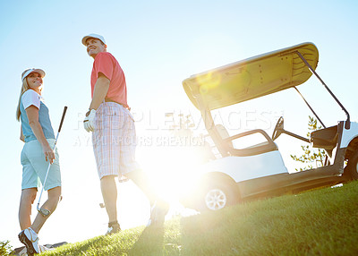 Buy stock photo Sports, happy and couple on golf course, field and grass for game, match and competition for activity. Low angle, hobby and man and woman for playing, fun and practice together to relax in morning