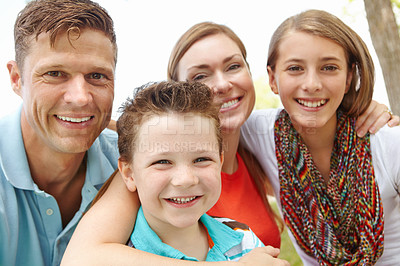 Buy stock photo Portrait of a happy family enjoying a day out together