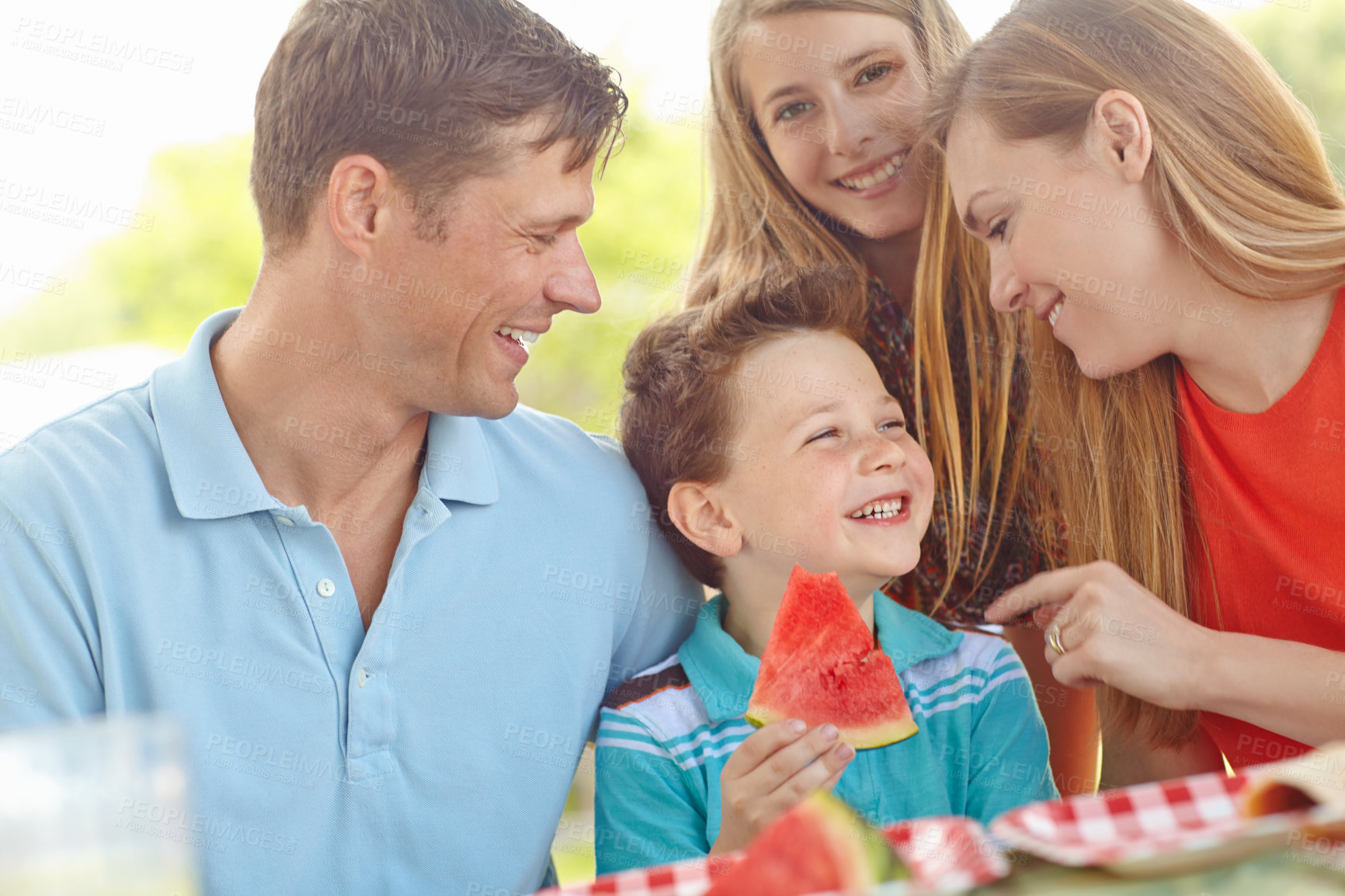 Buy stock photo Happy family, laugh or excited in nature for picnic, fun activity or watermelon for refreshing snack. Parents, children or favorite fruit in park for relationship development on vacation in Australia