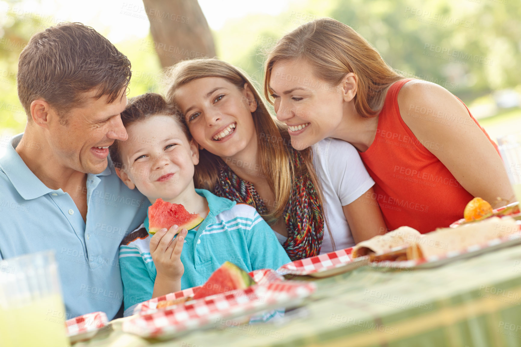 Buy stock photo Family, happy or love in nature for picnic, excited and watermelon for healthy snack. Parents, kids portrait and favorite fruit in park with smile, playful and support on summer vacation in Australia