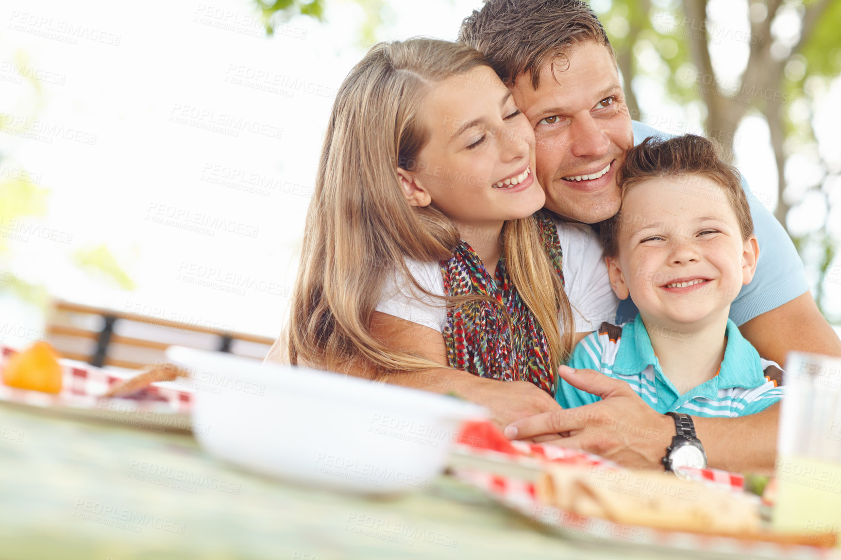 Buy stock photo Father, kids and happy at park on picnic for fun, support and care outdoor in France. Parent, girl and boy with smile as family for break with love, trust and child development or growth in garden