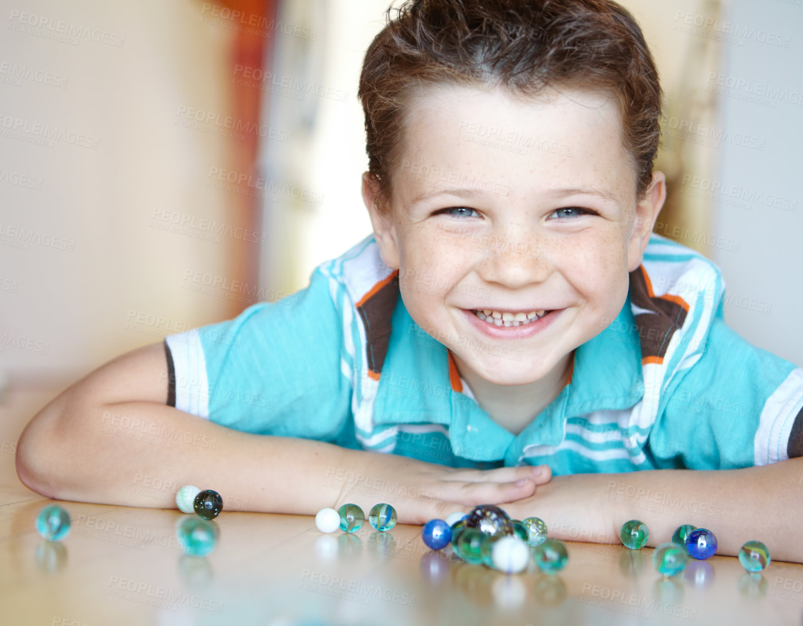 Buy stock photo Portrait, marbles and kid in home playing for learning, development and fun with smile. Excited, boy and confident child enjoying games with toys for childhood hobby or growth at house in England