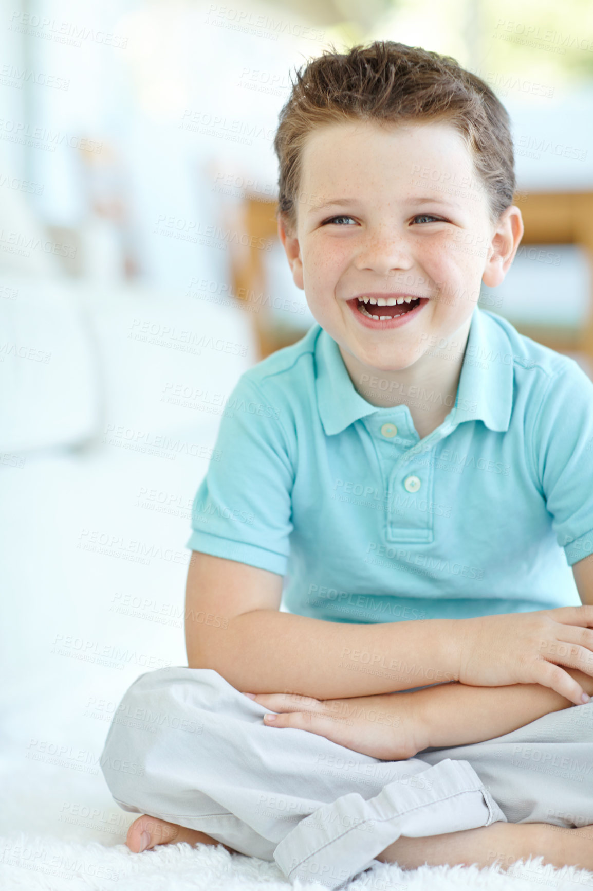 Buy stock photo Boy, happy child and laughing in home, morning confidence and chilling on floor of living room. Male person, kid and comfortable on carpet with funny joke, healthy growth and development in lounge