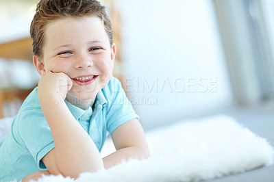 Buy stock photo Boy, happy child and weekend in home portrait, morning confidence and chilling on floor of living room. Male person, kid and comfortable on carpet in France, healthy growth and development in lounge