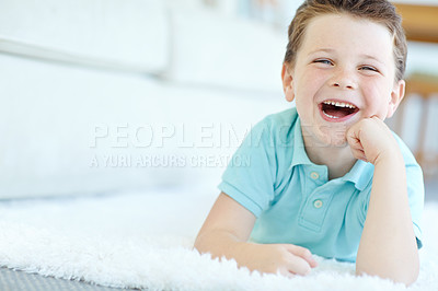 Buy stock photo Boy, happy child and laughter in home portrait, morning confidence and chilling on floor of living room. Male person, kid and funny joke on carpet in France, healthy growth and development in lounge