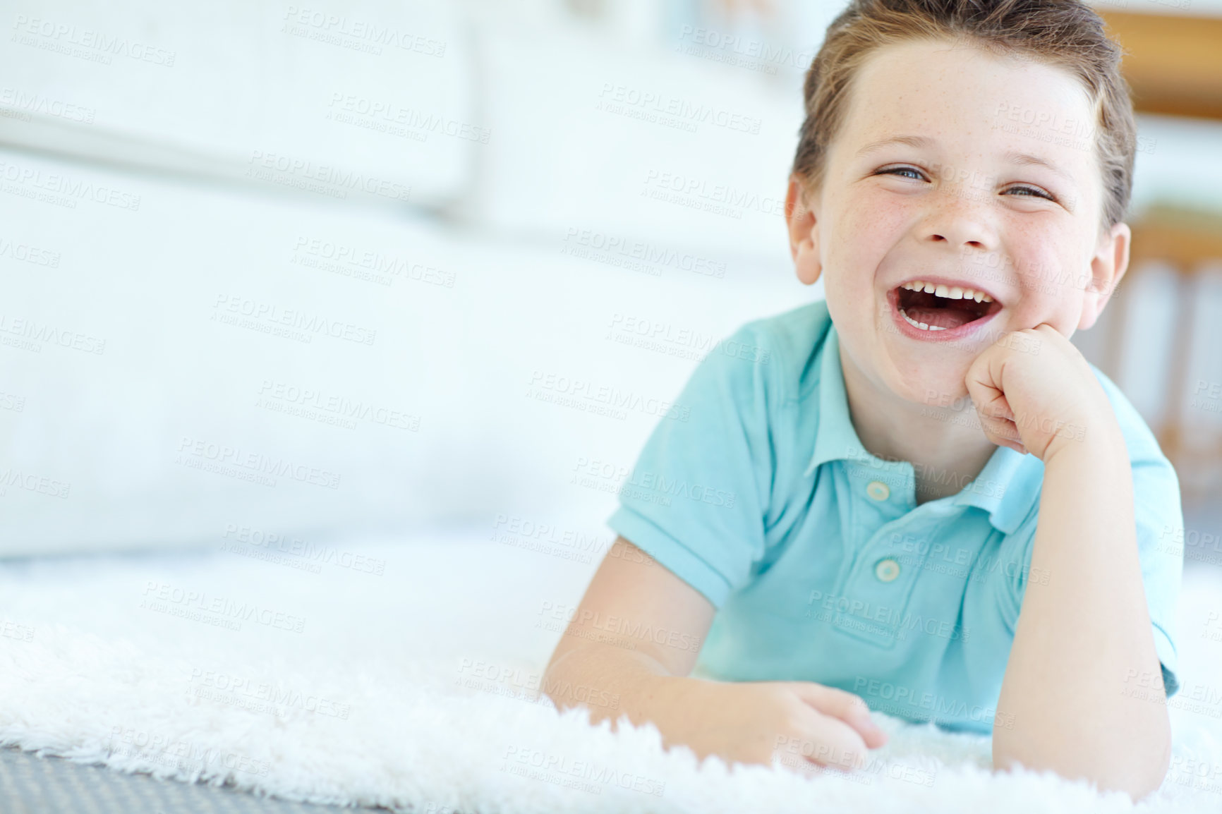 Buy stock photo Boy, happy child and laughter in home portrait, morning confidence and chilling on floor of living room. Male person, kid and funny joke on carpet in France, healthy growth and development in lounge