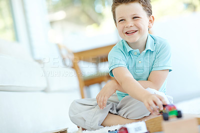 Buy stock photo Home, boy and happy with toy cars for fun or playful on school break on floor. Male person, kid and smile at apartment with driving vehicle for child growth, care and brain development at lounge