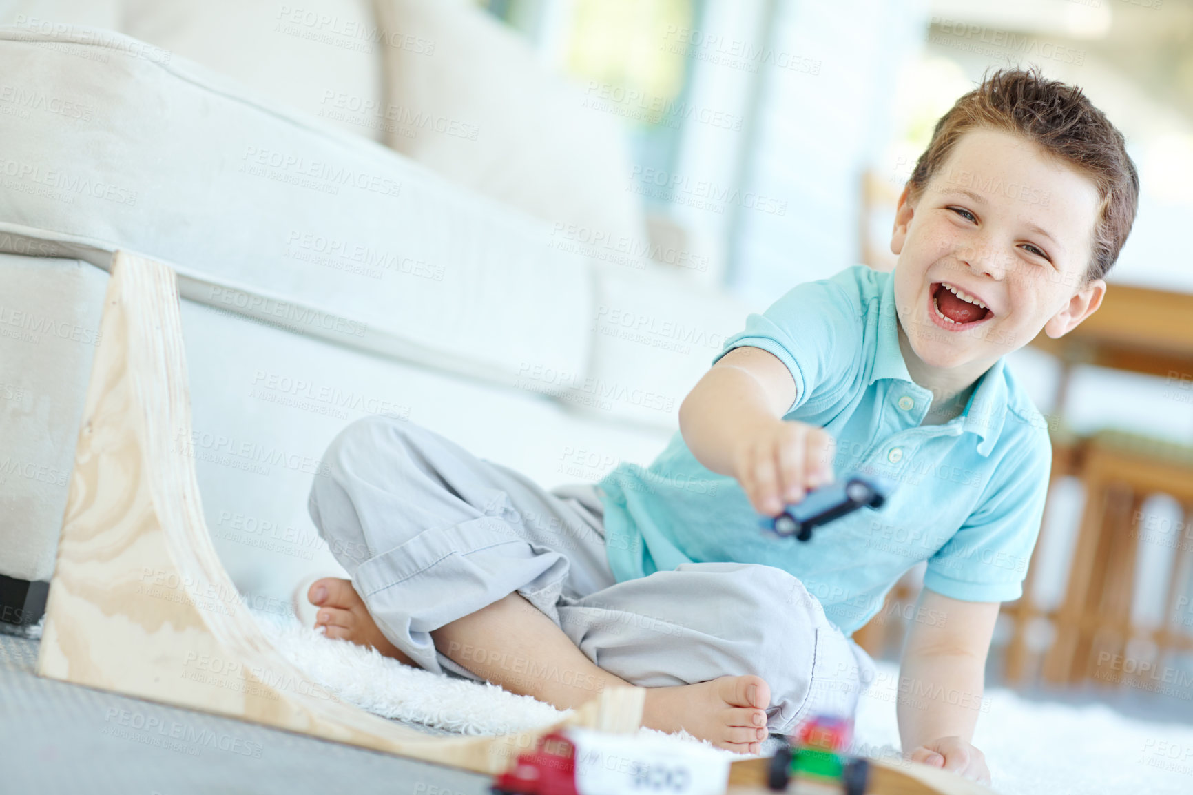 Buy stock photo Portrait, cars and kid in home playing for learning, development and fun with smile. Excited, boy and child enjoying games laughing with plastic toys for childhood hobby or growth at house in England