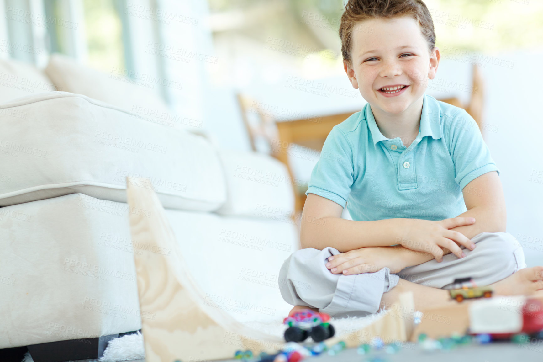 Buy stock photo Portrait, cars and confident kid in home playing for learning, development and fun with smile. Excited, boy and proud child enjoying games with toys for childhood hobby or growth at house in England