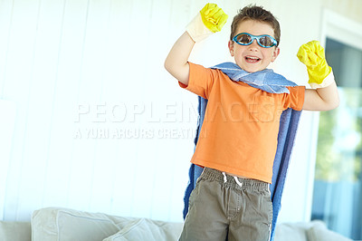 Buy stock photo Excited, kid and happy superhero in home to play fantasy game, laugh or celebrate. Smile, cute boy and funny hero with costume to fight for justice, power or creative cosplay in lounge on halloween