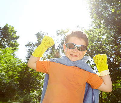 Buy stock photo Kid, boy and superhero portrait outdoor with fantasy game, play or pretend character with smile. Person, power and action fist with imagination for child development, adventure or halloween in nature