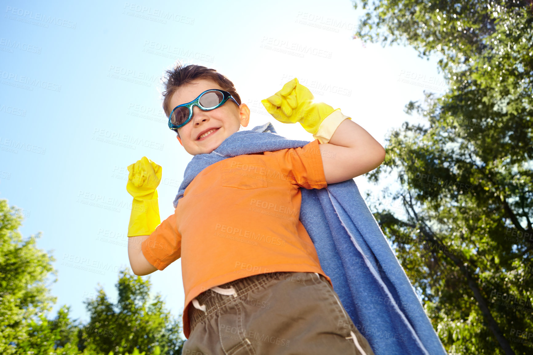 Buy stock photo Fantasy, portrait and superhero with boy outdoor for child development, games or growth in summer. Cape, costume and sunglasses with smile of happy kid in garden for crime fighting or defending