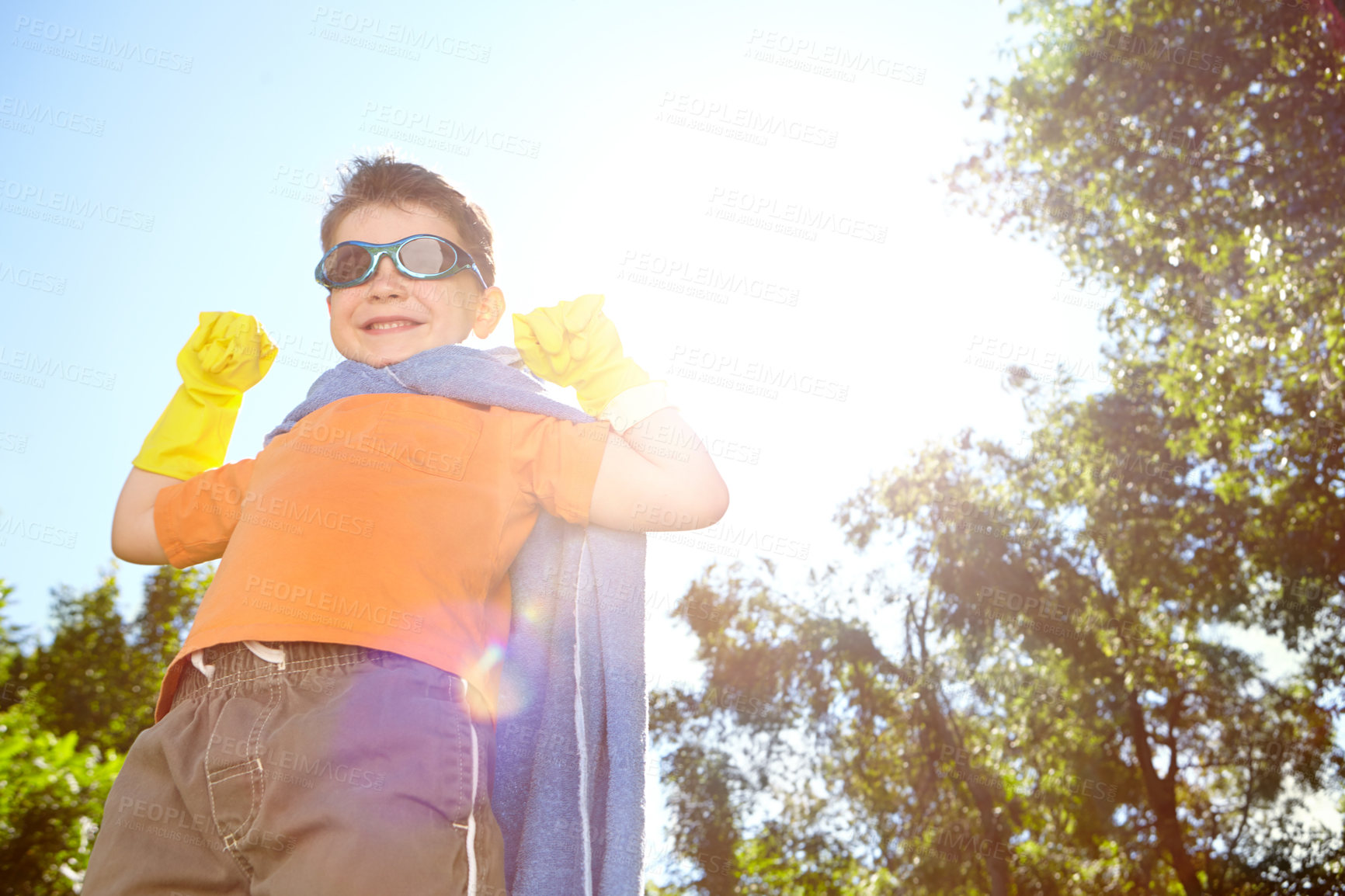 Buy stock photo Cape, portrait and superhero with boy in garden for child development, games or growth in summer. Fantasy, smile and sunglasses with happy kid in costume outdoor for crime fighting or defending