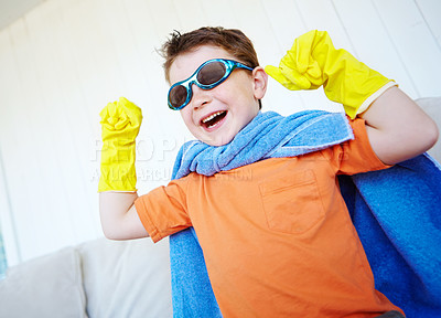 Buy stock photo Strong, child and happy superhero in home to play fantasy game on halloween. Smile, cute boy and hero with power in costume to fight for justice, laugh or flex muscle for creative cosplay in lounge