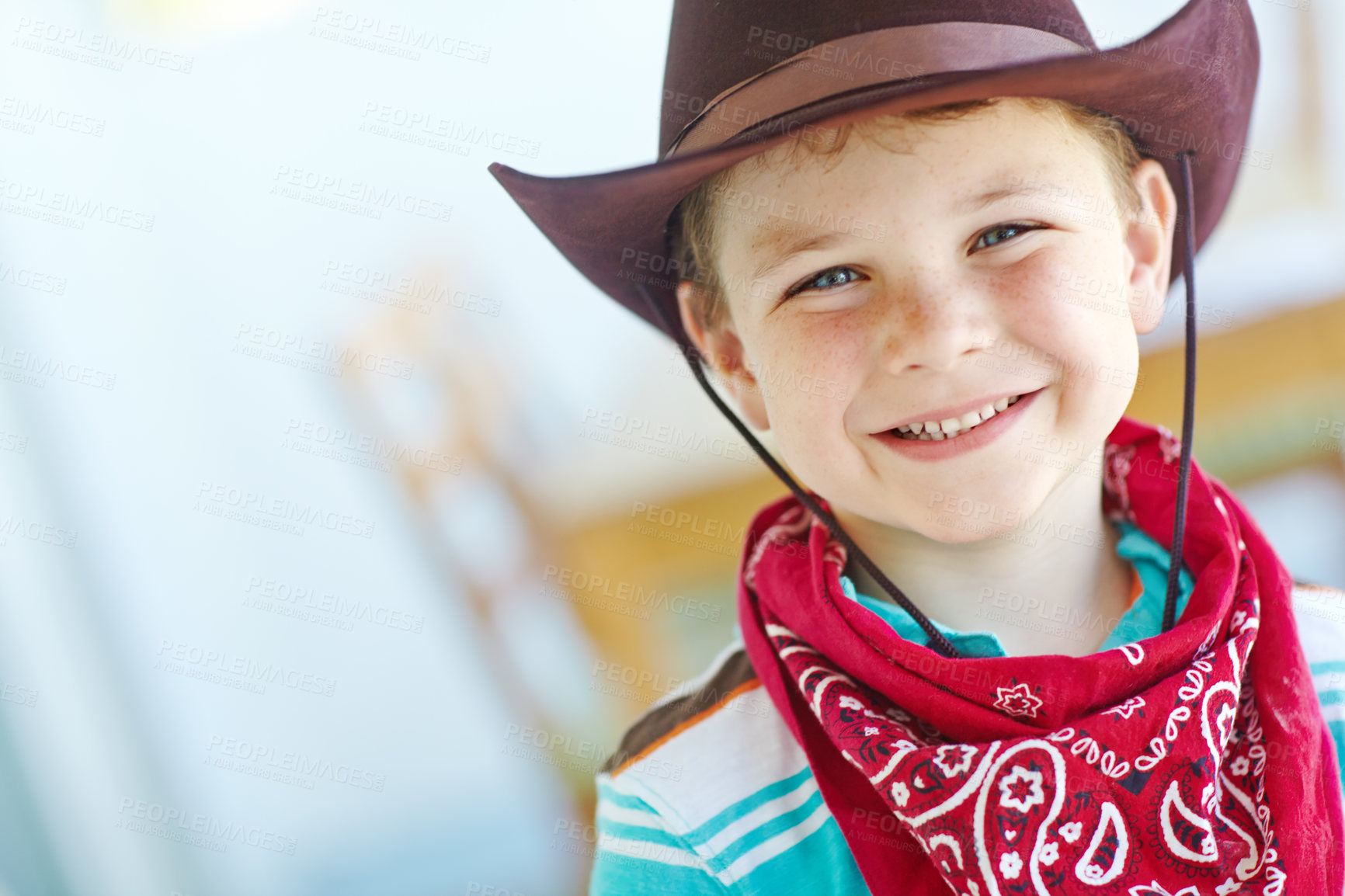 Buy stock photo Happy, cowboy or child in portrait in home, childhood and dress up for halloween concert with smile. House, kid and fantasy theme with vintage fashion for character role, cosplay and pride in Texas