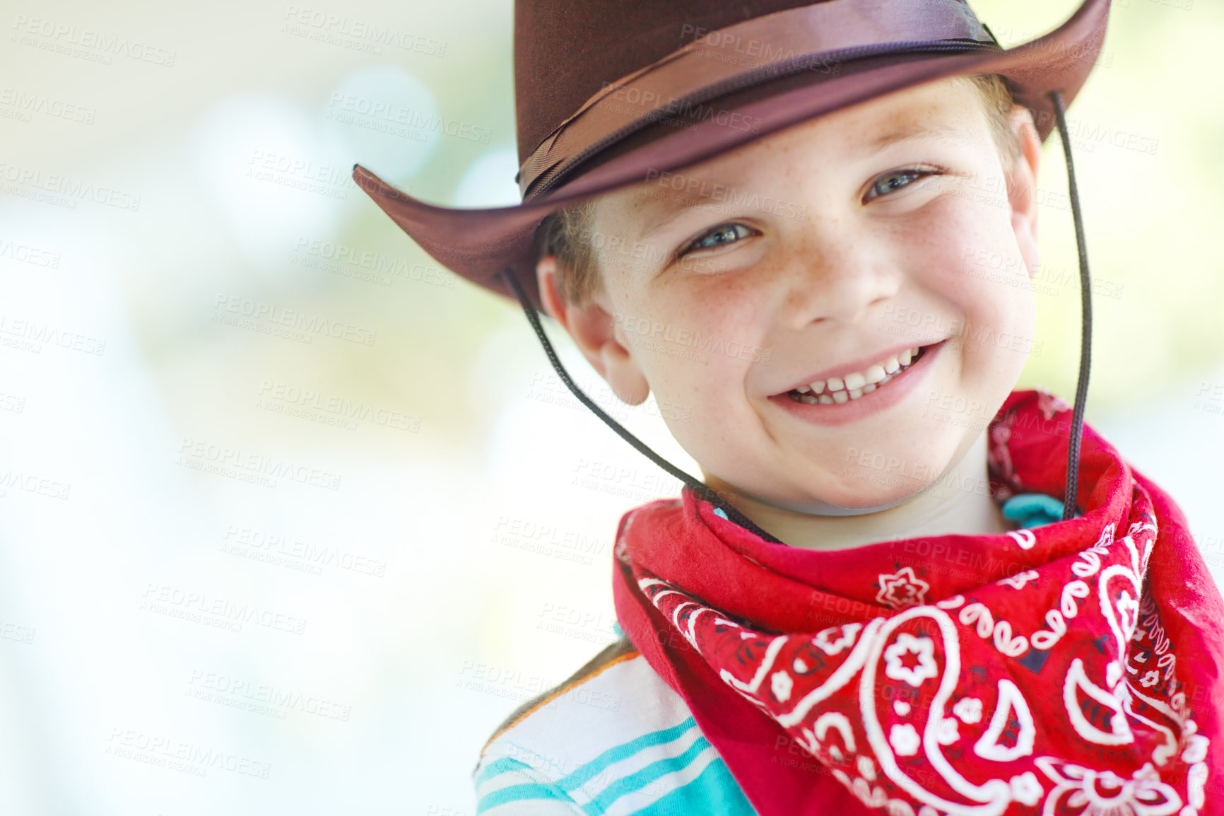 Buy stock photo Happy, cowboy or kid in portrait in home, childhood and dress up for halloween concert with smile. House, child and fantasy theme with vintage fashion for character role, cosplay and pride in Texas