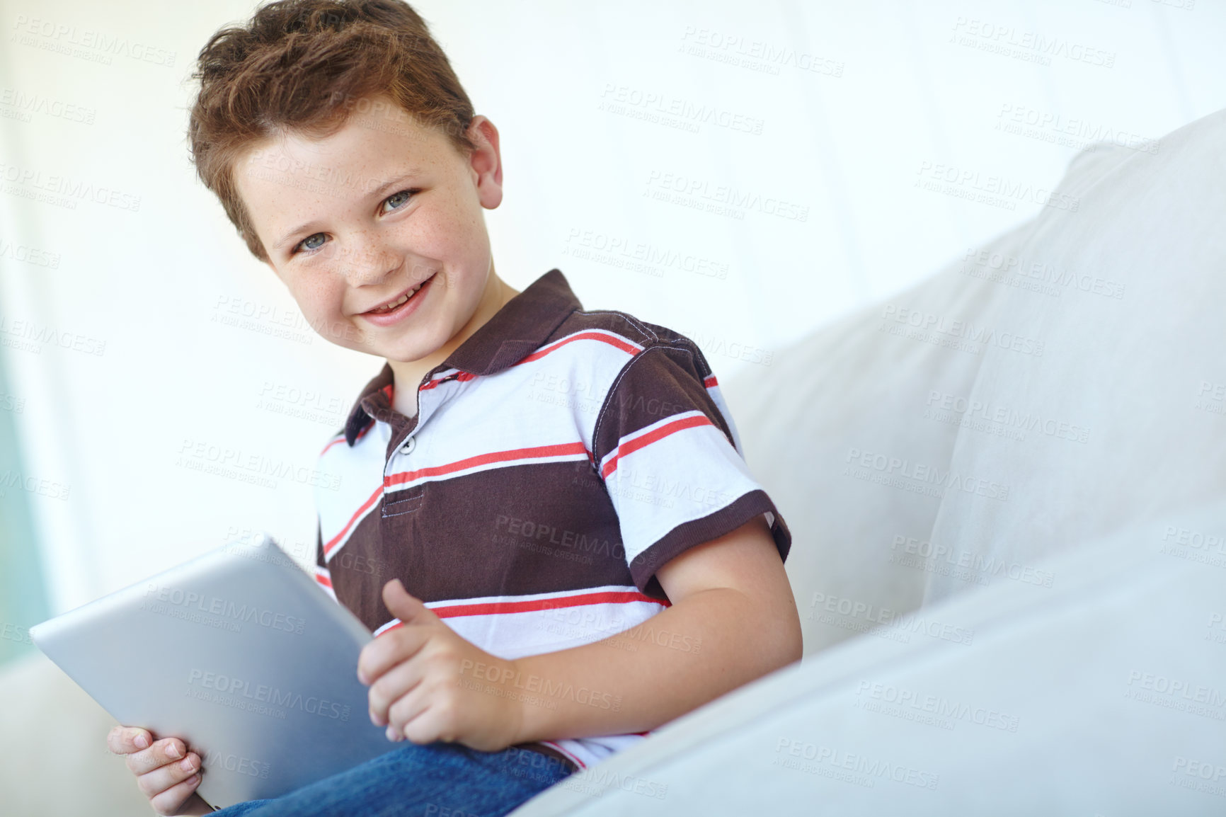 Buy stock photo Portrait, tablet and happy kid in home for learning on sofa in living room in Canada. Face, smile and boy child with digital technology for internet, scroll app or playing game for education in house
