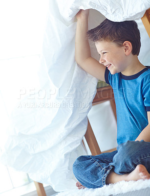 Buy stock photo Home, boy and happy with duvet for playing, entertainment and imaginative game for childhood. House, joyful child and comforter as shield for fantasy, hide and seek with laughing in lounge by carpet