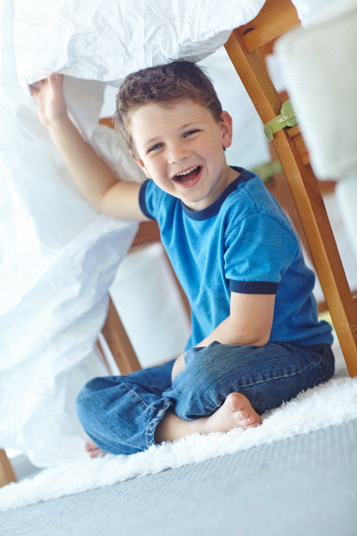 Buy stock photo Home, boy and portrait with duvet for playing, entertainment and imaginative game for childhood. House, happy child and comforter as shield for fantasy, hide and seek with laugh in lounge by carpet