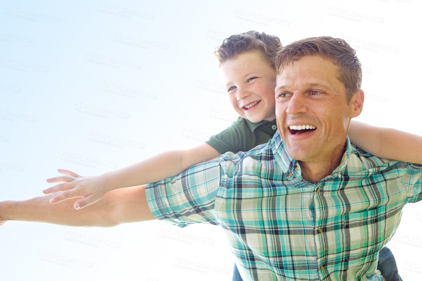 Buy stock photo Father, boy and outdoor with fly on piggyback for fun, support and care with sky in France. People, parent and smile with kid as family on break to play with love, trust and child development