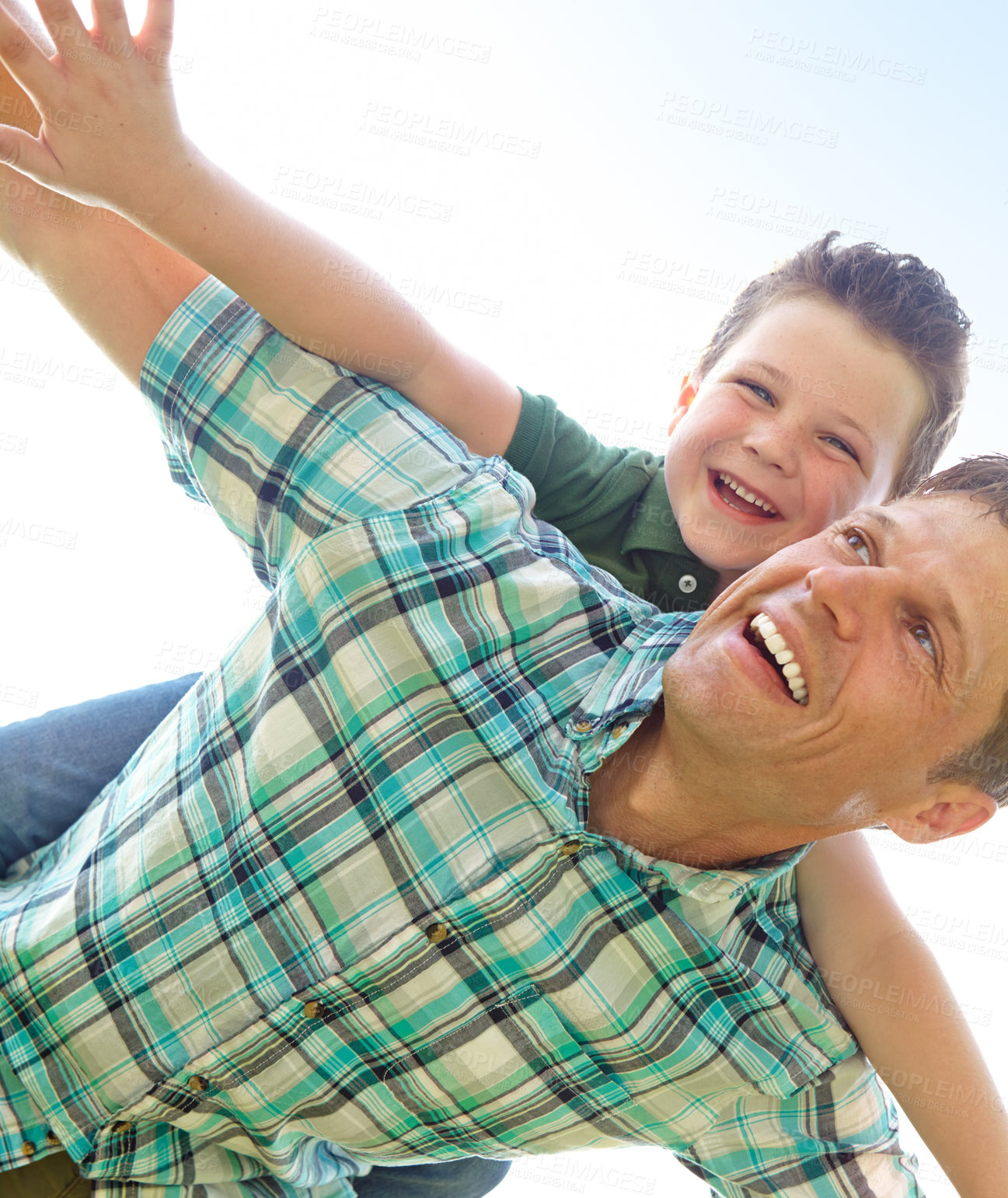 Buy stock photo Father, boy and sky with fly on piggyback for fun, support and care outdoor in France. People, parent and smile with kid as family on break to play with love, trust and child development or growth