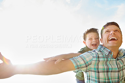 Buy stock photo Dad, boy and outdoor with fly on piggyback for fun, support and care with sky in France. People, parent and smile with kid as family on break to play with love, trust and child development or growth