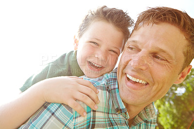 Buy stock photo Face, funny or piggyback with father and son outdoor together for bonding, comedy or having fun. Happy, laughing or sky with single parent man and boy child joking or playing for relationship