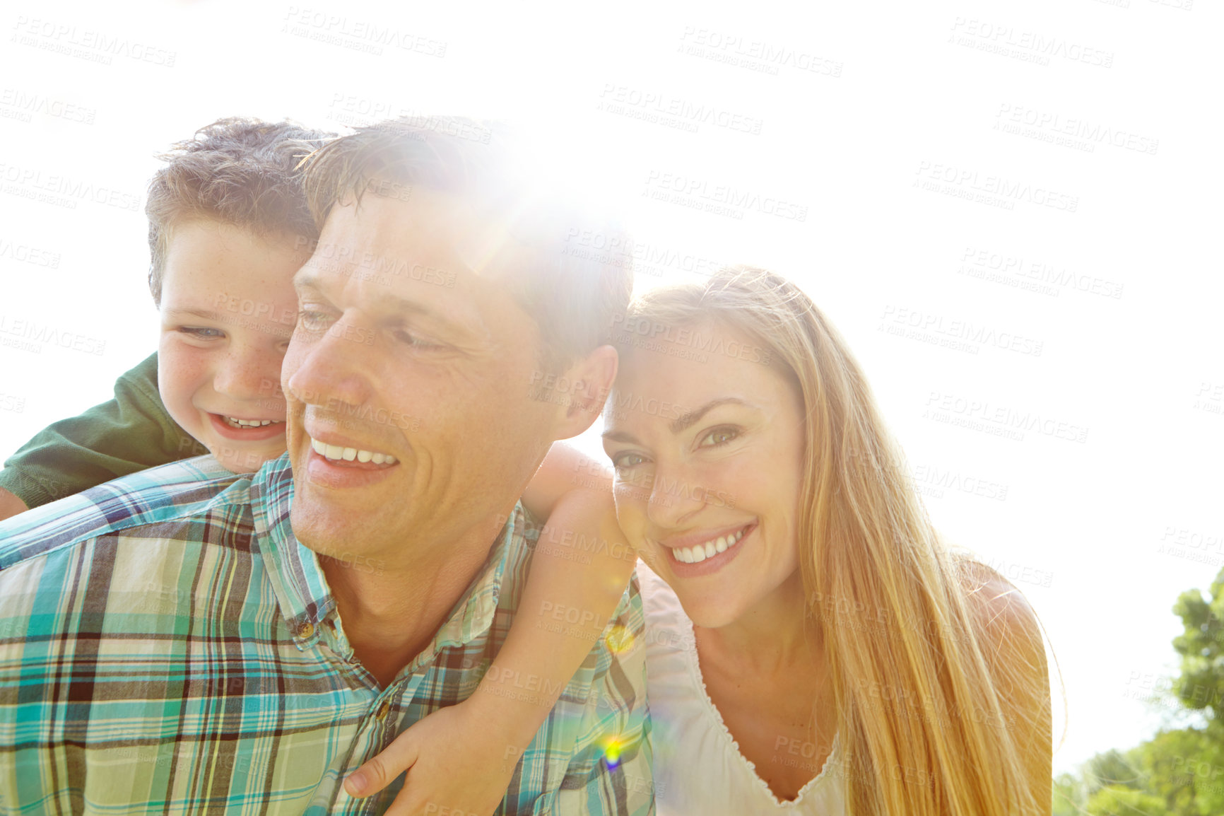 Buy stock photo Outdoor, happy family and bonding in summer on weekend, holiday or vacation in backyard or garden. People, child and piggyback as parents with joy, smile and playful for fun, love and support in park