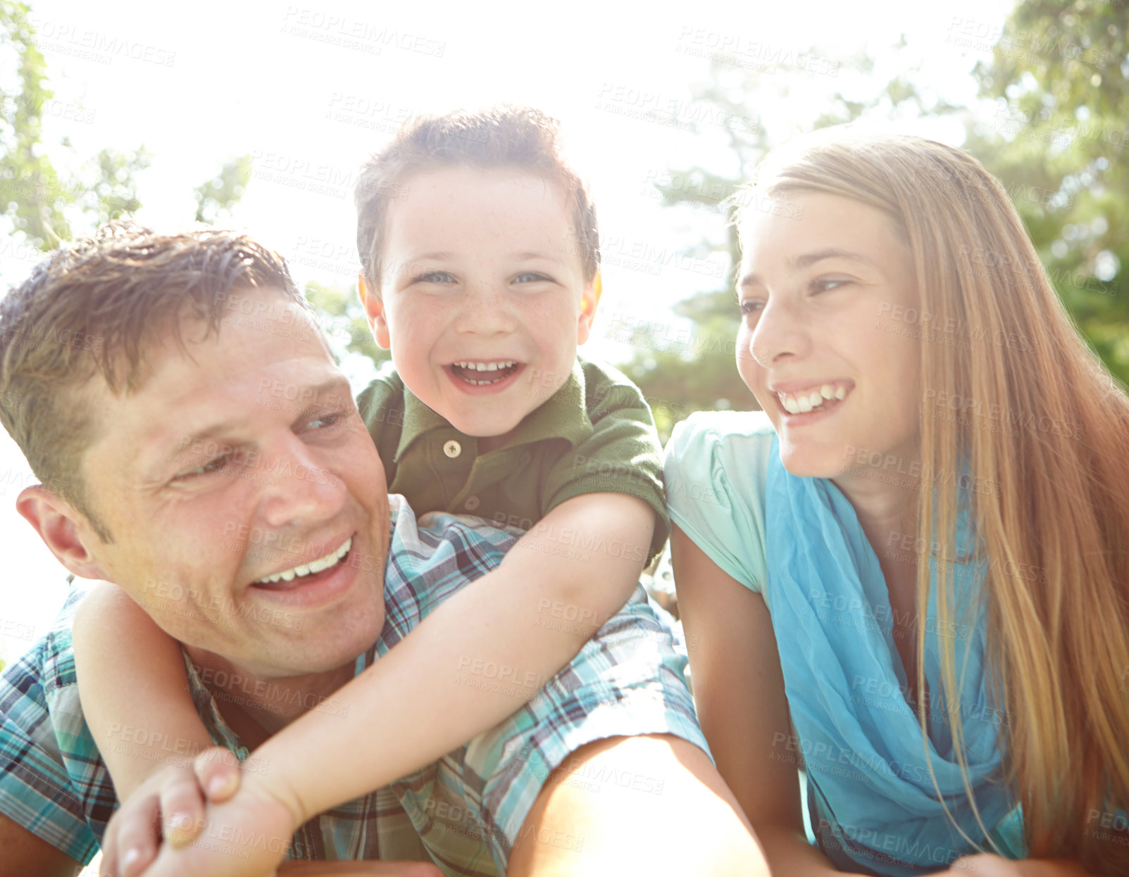 Buy stock photo Selfie, smile and boy with parents, outdoor and humor with happiness, memory and bonding together. Portrait, childhood and kid with adventure, cheerful and weekend break, embrace and laughing in park