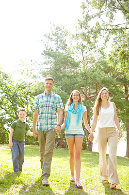 Buy stock photo Family, love and holding hands in park for portrait, trust or excited for adventure in Australia. Parents, children or gesture in nature for guidance, support and safety on holiday or summer vacation