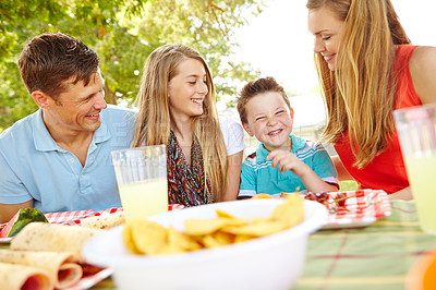 Buy stock photo Kids, happy family and parents at picnic with food for party and eating fruits for thanksgiving. Smile, lunch and people outdoor with mother, father and children for celebration together on holiday