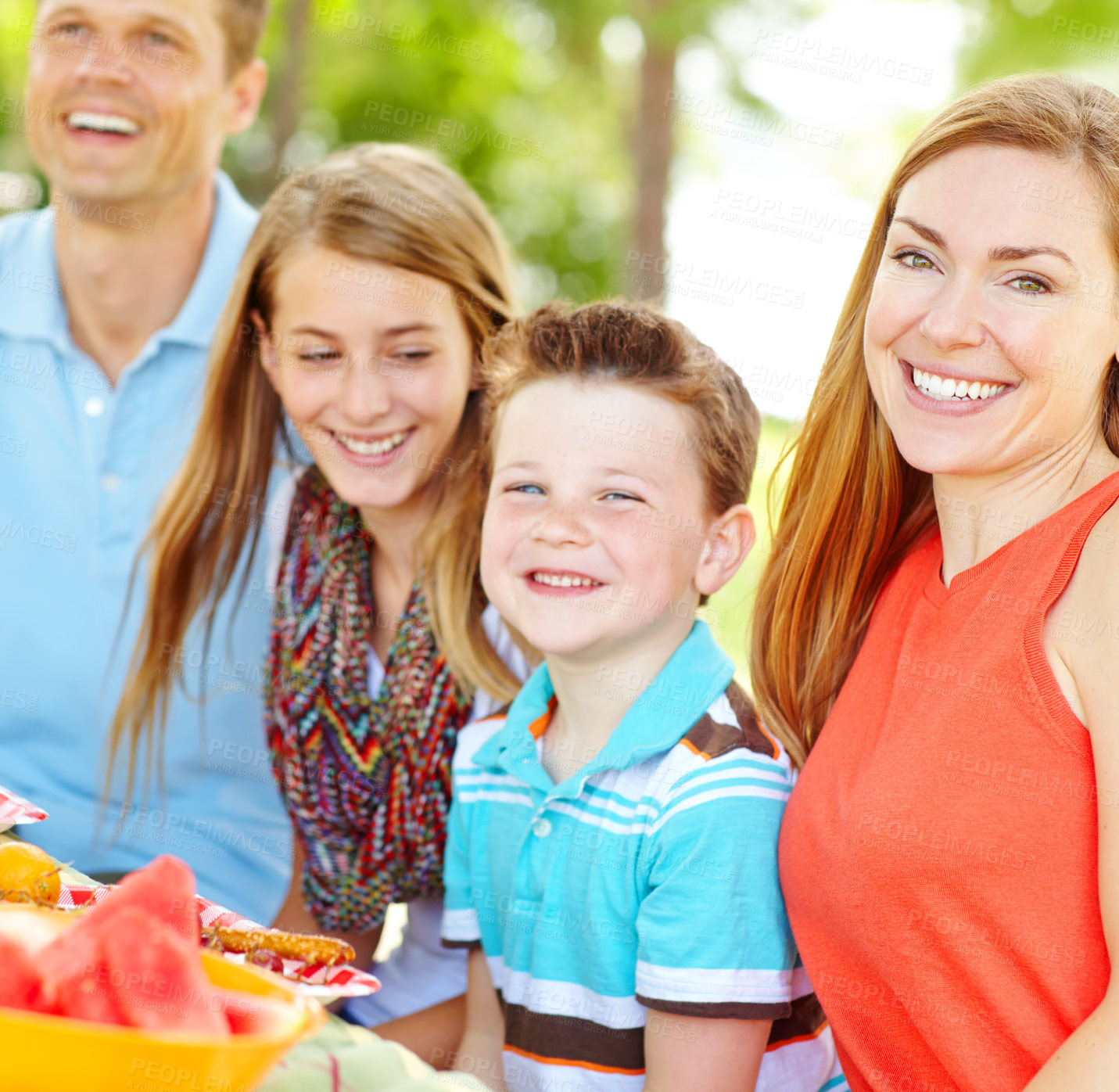 Buy stock photo Kids, happy family and parents at picnic for lunch, party and eating fruits at thanksgiving. Smile, food and people outdoor with mother, father and children for celebration on summer holiday together