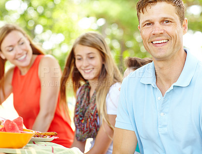 Buy stock photo Portrait, family and bonding with dad, picnic and parents with siblings, nutrition or healthy in nature. Happy, woman and man with kids, vegan and fruit in weekend, fun and break in park and together