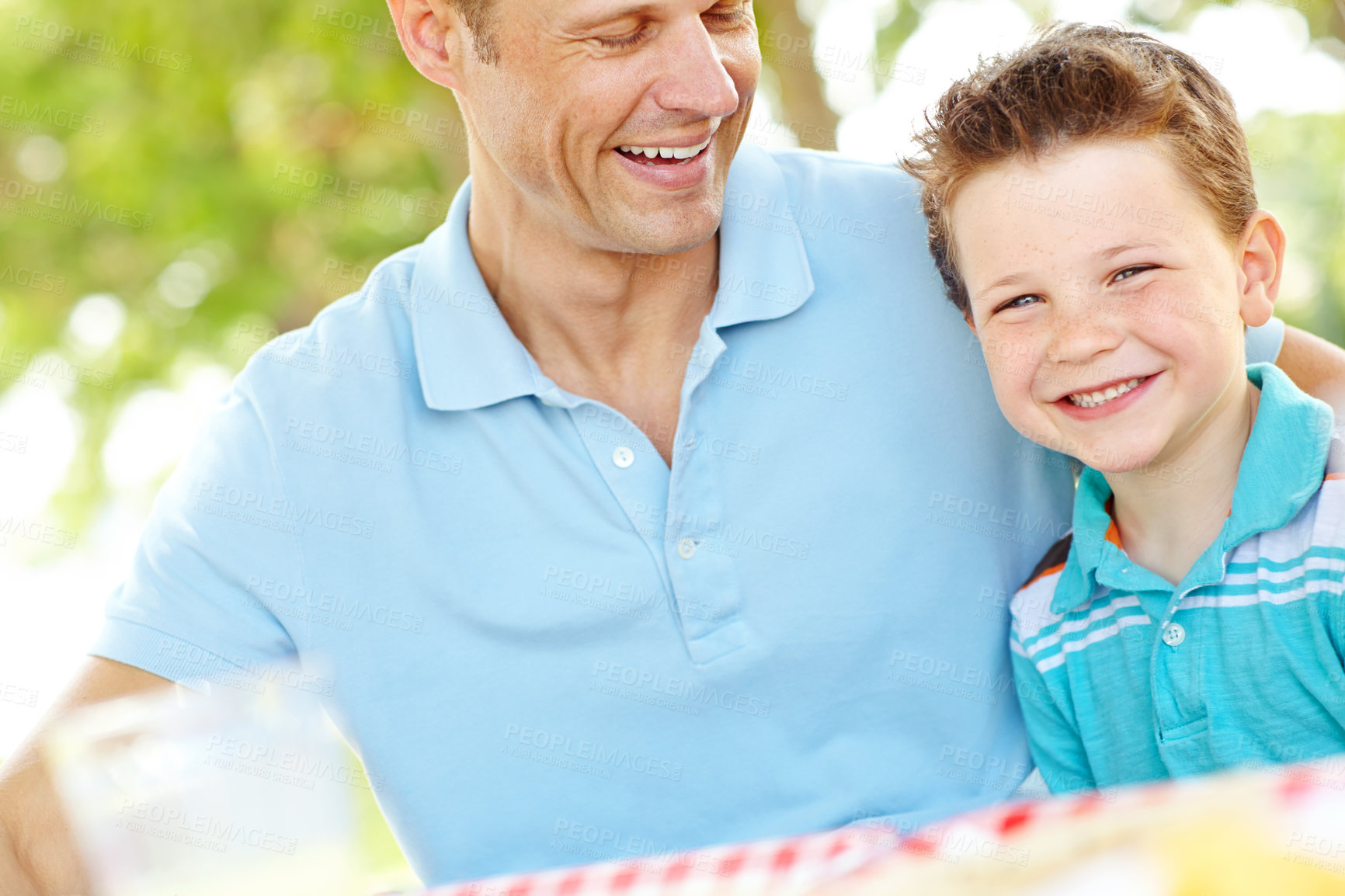 Buy stock photo Father, boy and happy at park on picnic for fun, support and care outdoor in France. People, parent and smile with kid as family on break to play with love, trust and child development or growth