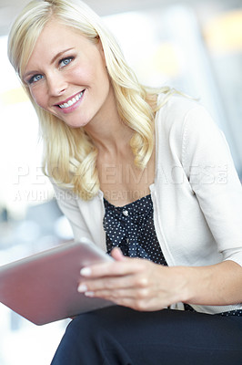 Buy stock photo Portrait of a smiling business woman holding her digital tablet in an office environment 