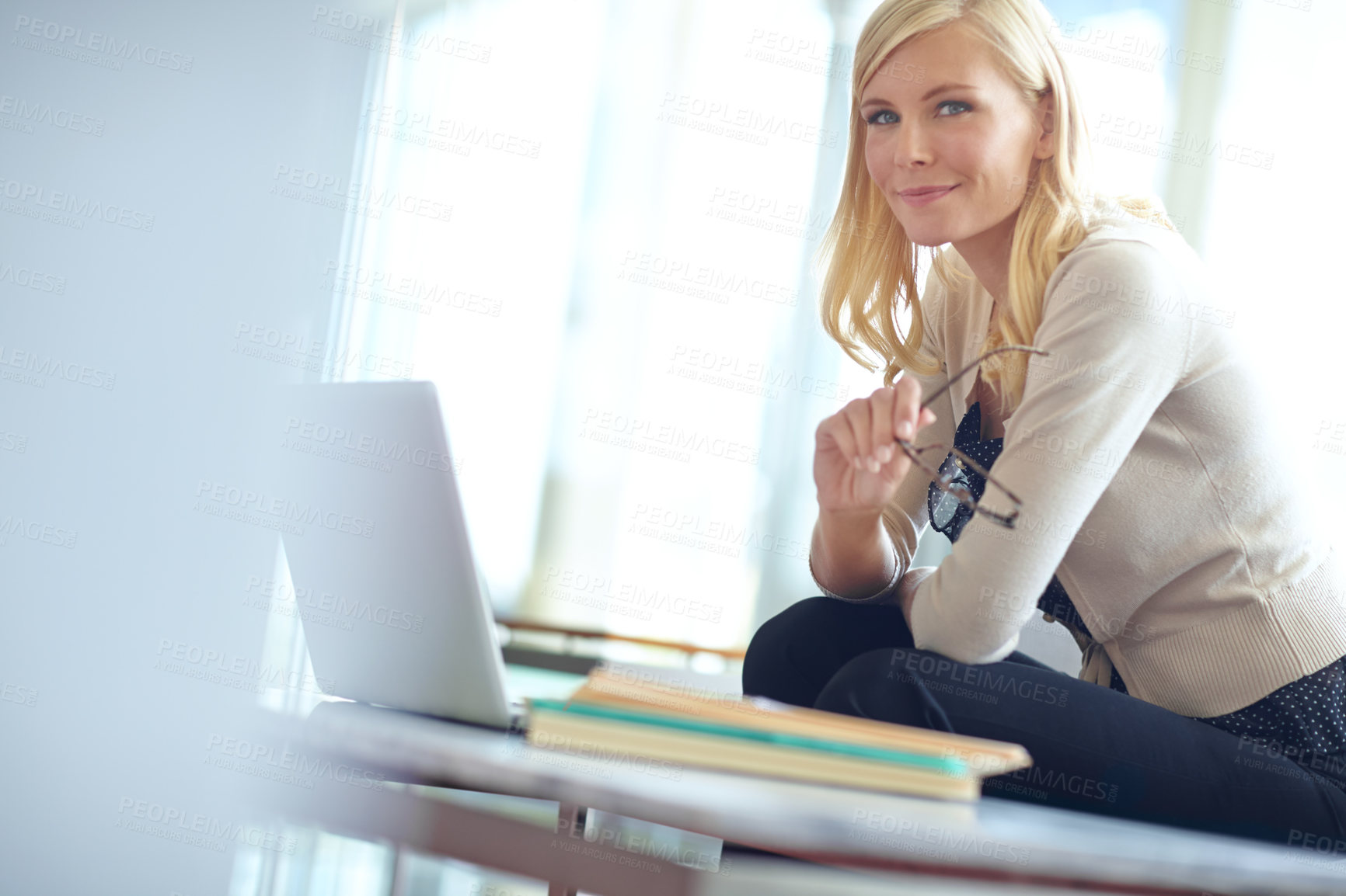 Buy stock photo Laptop, portrait and smile with business woman on sofa in office for administration or review. Computer, glasses and planning with confident employee in professional workplace for online research