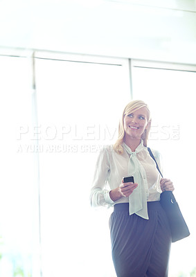 Buy stock photo Office, ideas and businesswoman with cellphone for chat, feedback or notification from contact. Workplace, female person or consultant with smartphone for message, scroll online and thinking by space