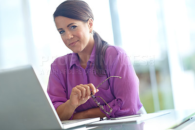 Buy stock photo Glasses, laptop and portrait with business woman at desk in office for administration or online research. Computer, eyewear and review with happy employee in professional workplace for development