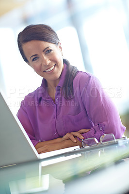 Buy stock photo Laptop, portrait and smile with business woman at desk in office for administration or online research. Computer, information and review with happy employee in professional workplace for development