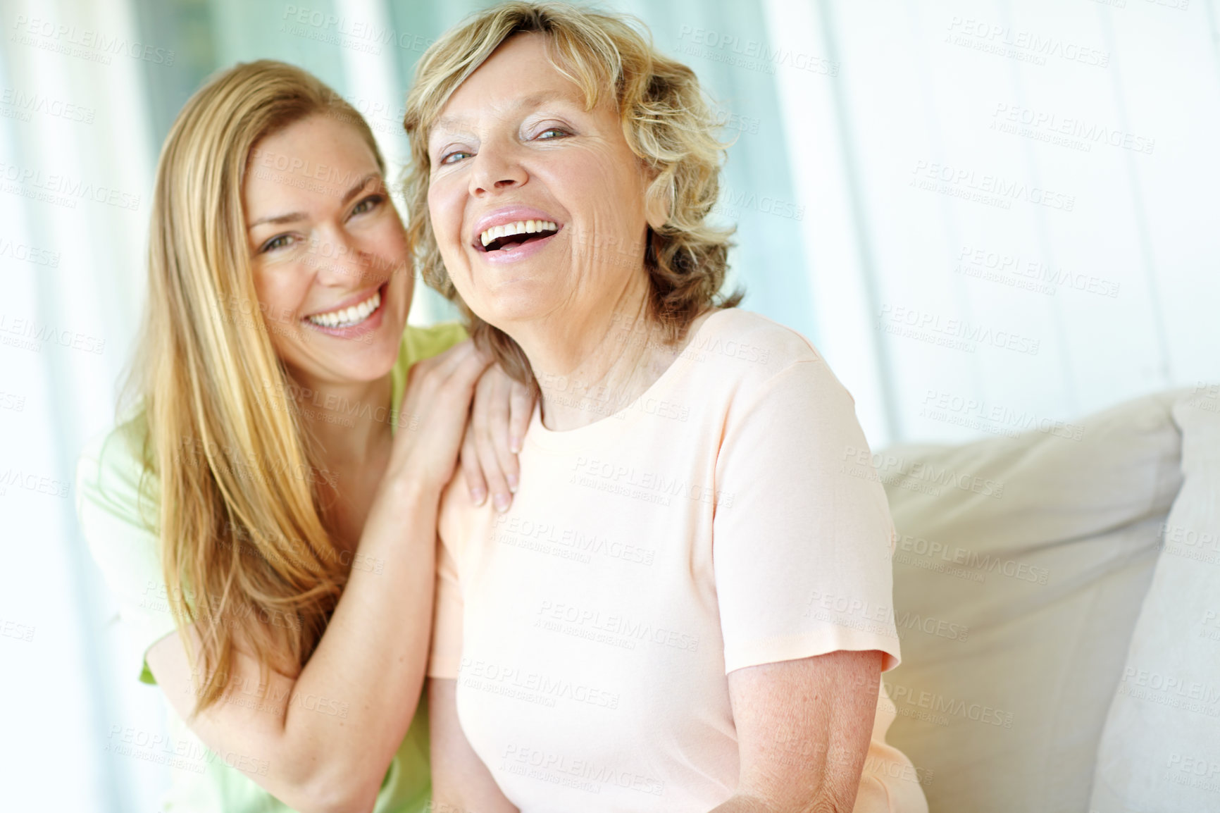 Buy stock photo Sofa, senior mother and woman in portrait with embrace, funny memory and bonding together at home. Happy people, mom and adult daughter with connection for family, relationship and laughing on couch