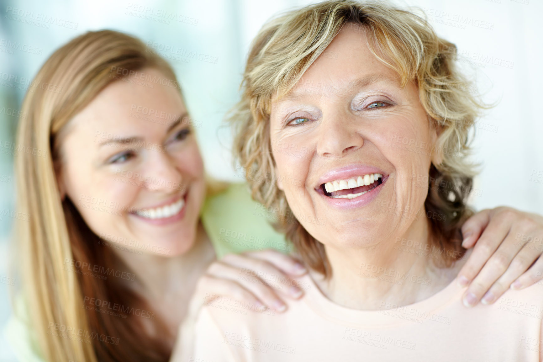 Buy stock photo Portrait, mature mom and daughter in home with bonding, smile and morning embrace in living room together. Relax, senior mother and girl with happy face for love, care and family support in apartment