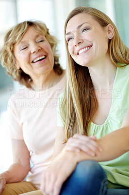 Buy stock photo Smile, mature mother and daughter in home with morning bonding, laugh and fun on couch in living room together. Relax, senior mom and girl on sofa with happy face for love, care and family support