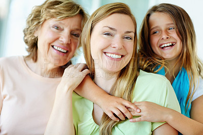 Buy stock photo Hug, happy child and mother with grandmother for family generations with care, love and bonding together. Face, grandparent and kid embrace mom for support, connection and laughing with women at home