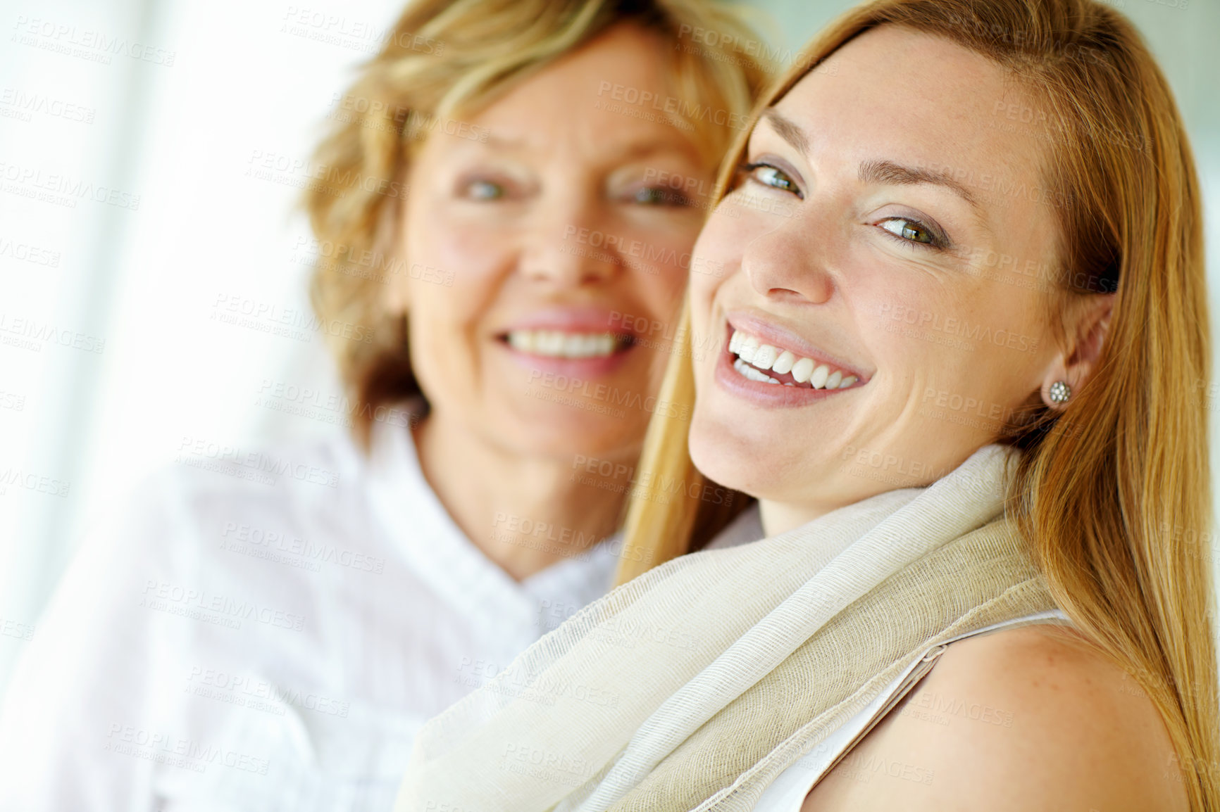 Buy stock photo Portrait, mature mother and daughter laughing in home with bonding, smile and morning embrace in living room together. Relax, senior mom and girl with happy face for love, care and support in house